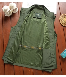 Detail of outdoor vest featuring breathable mesh lining and dark green nylon fabric