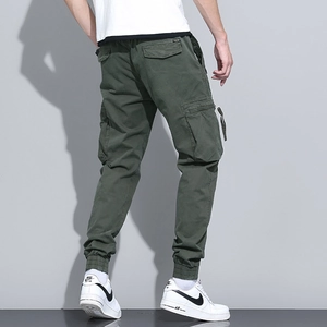 Army green men's cargo joggers with multi-pockets and ribbed cuffs, back view detail