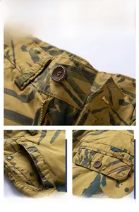 Close-up of camouflage cargo shorts featuring metal zipper and reinforced stitching detail