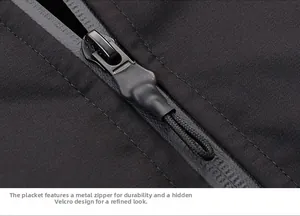 Detail of waterproof front zipper on black thermal down jacket with metal puller