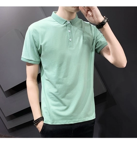 Detail of light green slim fit cotton polo shirt featuring a classic three-button placket