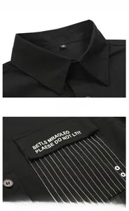 Detailed view of black military shirt showing collar size label and printed chest pocket