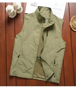 Detail of army green outdoor utility vest with zip pockets and breathable mesh lining