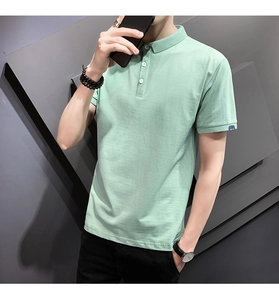 Detail of light green men's Polo shirt featuring three-button placket and woven sleeve tag