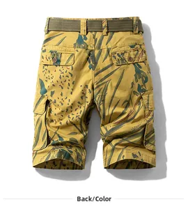 Detail view of tropical leaf pattern cargo shorts with rear pockets and green belt