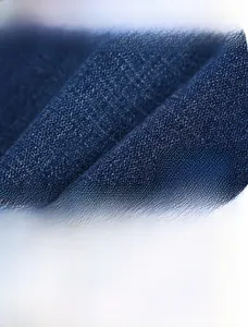 Detail of high-density blue denim twill fabric made of breathable long-staple cotton