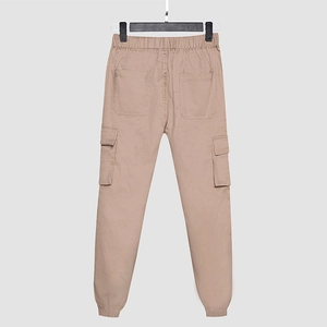 Men's khaki cargo jogger pants with elastic waist and side flap pockets on a hanger