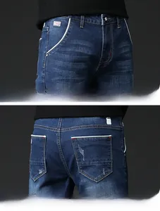 Detailed macro view of deep blue denim texture with white piping and red contrast stitching