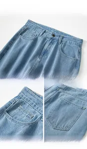 Detalle de vaqueros azul claro con botón metálico, bolsillos reforzados y costuras