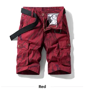 Detailed view of red cargo shorts featuring multiple pockets and a black canvas belt