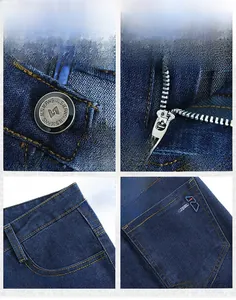 Detail view of dark blue heavy denim jeans showing metal buttons and orange stitching