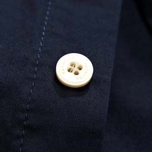 Navy blue men's casual shirt featuring a fashion engraved button and twill texture