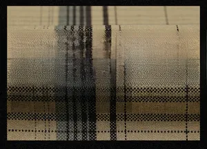 Close-up of khaki plaid cotton fabric texture showing durable woven fibers and patterns