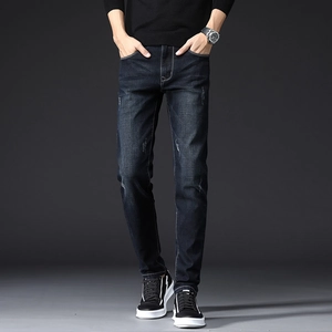 Slim fit men's dark blue jeans with stretch, featuring cat-whisker wash and micro-distressed details