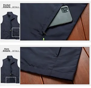 Detail of dark blue outdoor vest featuring functional zip pockets and durable stitched hem