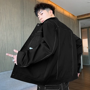 Men's black workwear jacket with white contrast stitching and canvas texture