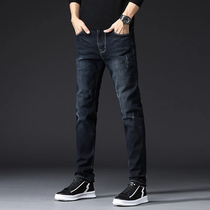 Slim fit men's stretch denim jeans in deep indigo with subtle distressed details