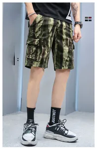 Detail shot of men's camouflage cargo shorts featuring large flap pockets and street style