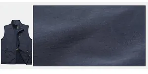 Detail showing high-quality nylon fabric texture and zipper pocket on outdoor fishing vest