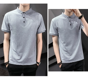 Detailed view of light gray polo shirt with ribbed collar and black striped sleeve cuffs