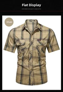 Detail of khaki plaid cotton shirt featuring dual chest pockets and metal buttons