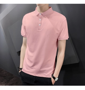 Detail of pink polo shirt collar with three white buttons and black sleeve label