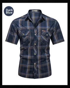 Detail of dark blue plaid short sleeve shirt with symmetric chest utility pockets