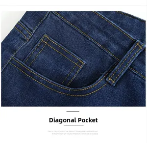 Detail of deep blue denim jeans featuring slanted side pockets and yellow contrast stitching