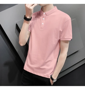 Detail of light pink slim fit polo shirt with classic three-button collar and black sleeve tag