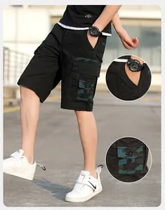 Detail of men's black cargo shorts featuring camouflage pockets and side pocket design