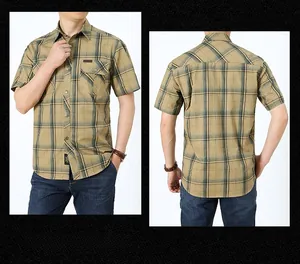 Detail of men's khaki plaid short sleeve shirt featuring front flap pocket and leather tag