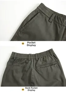 Detail view showing elastic waist, side pockets and secure zip back pocket on cargo pants