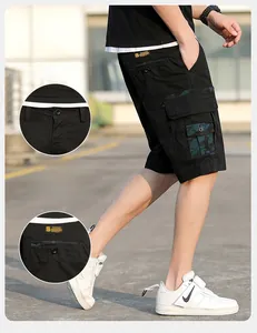 Detail of men's black cargo shorts featuring camouflage texture side pockets and drawstring