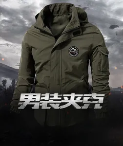 Detail view of army green hooded jacket showing mountain badge and military sleeve pocket