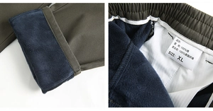 Detail of army green cotton pants with thick blue fleece lining and elastic waistband