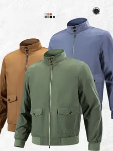 Detail of stand collar jackets in olive, tan, and blue with ribbed cuffs and large pockets