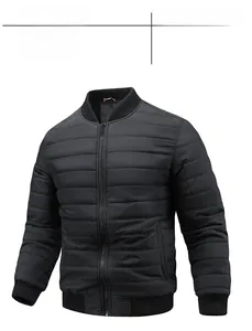 Detail of black quilted men's bomber jacket with ribbed cuffs and stand collar design