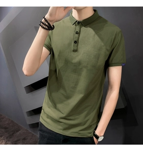 Detail of army green polo shirt featuring ribbed cuffs and a small blue woven brand label