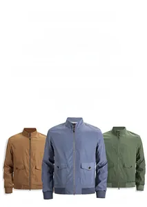 Detail view of cotton work jackets in khaki, blue and green with stand collar design