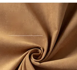 Detailed macro view of warm camel color high quality fabric texture and soft fold