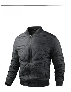 Detail of men's black quilted jacket featuring rib-knit collar and diamond stitch pattern