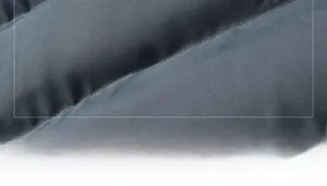 Detail showing 100% polyester fabric texture and material specifications of the men jacket