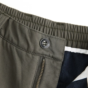 Men's casual olive pants featuring elastic waist with warm fleece lining detail