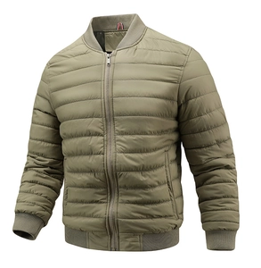 Detail of olive green quilted bomber jacket with ribbed cuffs and metallic zipper