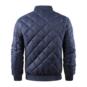 Rear view of navy blue quilted jacket with ribbed stand collar and diamond stitching