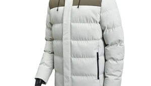 Detail of hooded winter jacket showing contrast olive green shoulders and cream quilted fabric