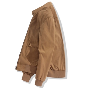 Detailed close-up of khaki utility jacket with stand collar and rib-knit cuffs