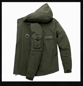 Detail view of military green hooded jacket showing arm pocket and SEEK ADVENTURE print