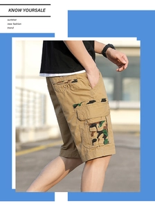 Detail view of khaki cargo shorts showing camo stitching and multi-pocket design on the side