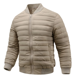 Detail of light khaki quilted bomber jacket featuring ribbed collar and zipper pockets